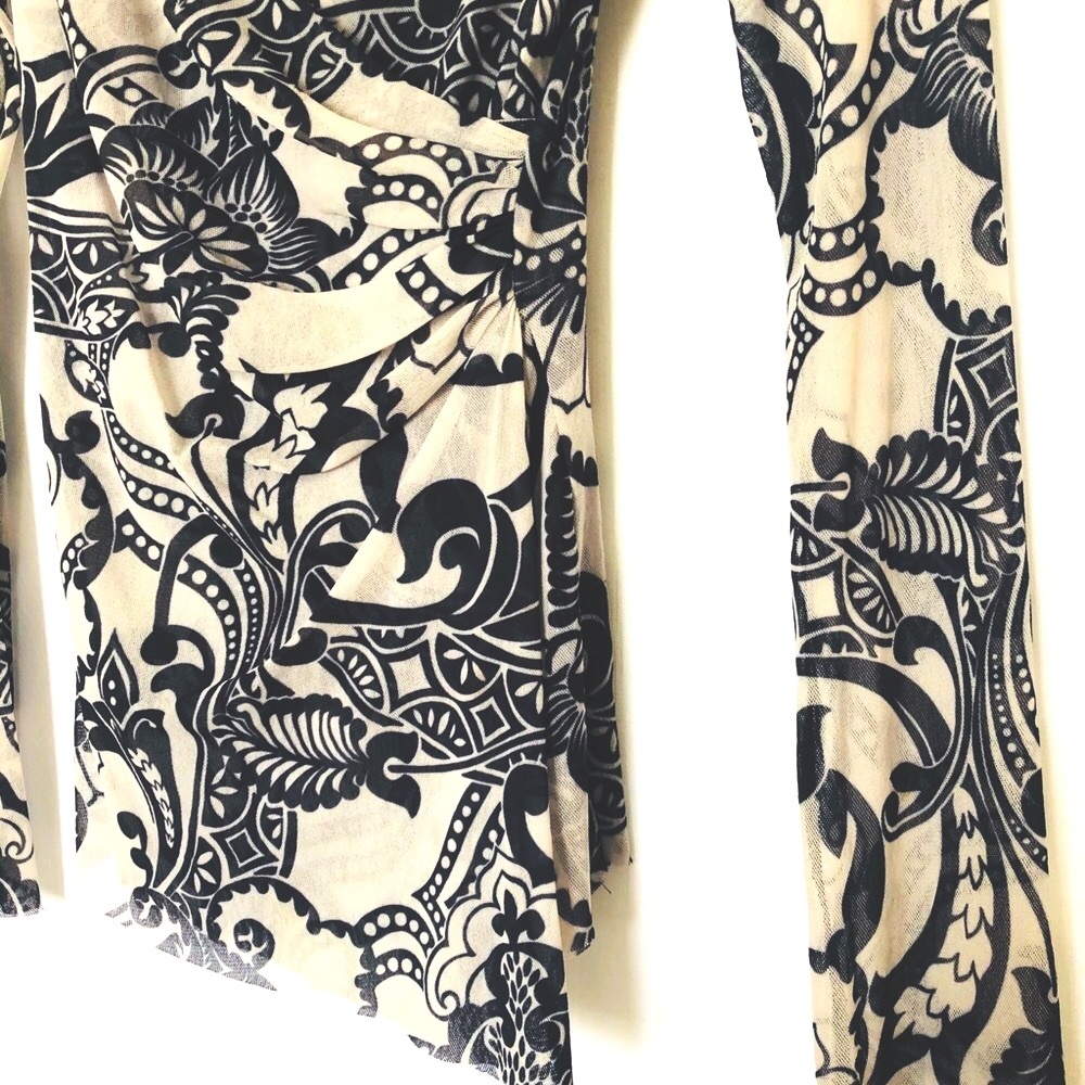 Sweet pea double layered mesh woven top. Great print. Funky cool, bell sleeves - Picture 8 of 10